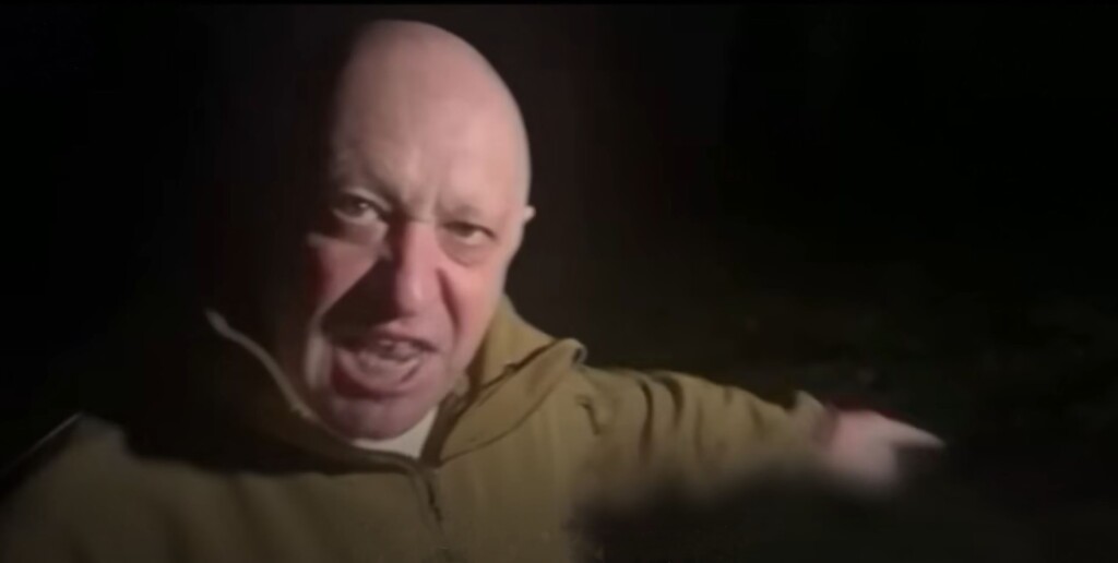 In this ghostly image, Wagner boss Yuri Prigozhin points to the dead bodies of his hired mercenaries during a furious rant. Screenshot from YouTube and The Times and Sunday Times