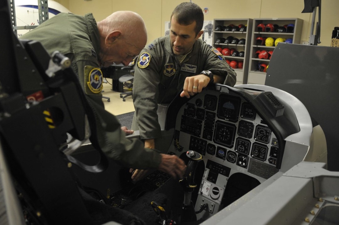 Capt. Steven Parsons, 47th Student Squadron T-6A Texan II instructor pilot, shows the T-6 trainer to retired Capt. Jerry Yellin, a former World War II U.S. Army Air Corps fighter pilot, during initial training for an orientation flight Dec. 16, 2016. After graduating from Luke Air Field as a fighter pilot in August of 1943, he spent the remainder of the war flying P-40, P- 47 Thunderbolt and P-51 Mustang combat missions in the Pacific with the 78th Fighter Squadron, known as the "Bushmasters." (U.S. Air Force photo/Tech. Sgt. Mike Meares)