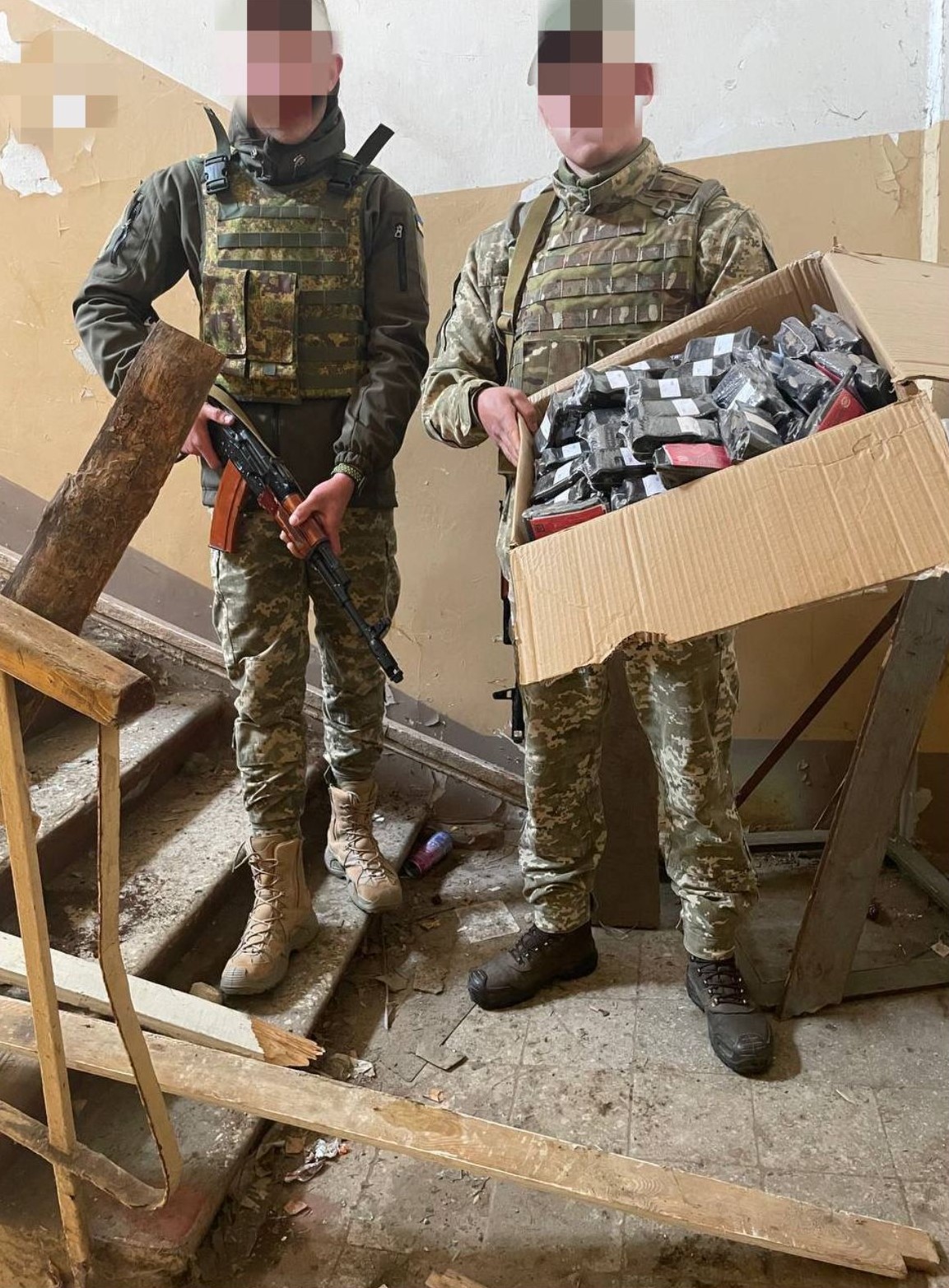 Men holding supplies