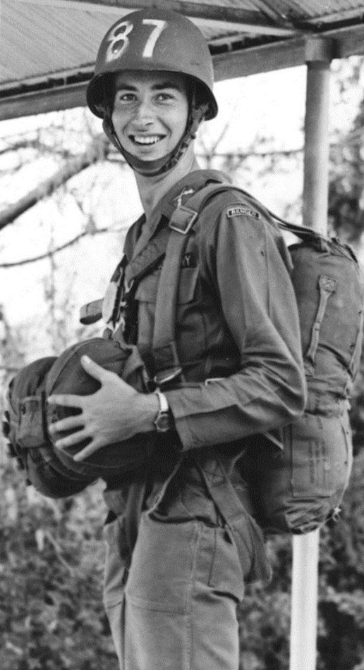 The general standing with a parachute in 1960