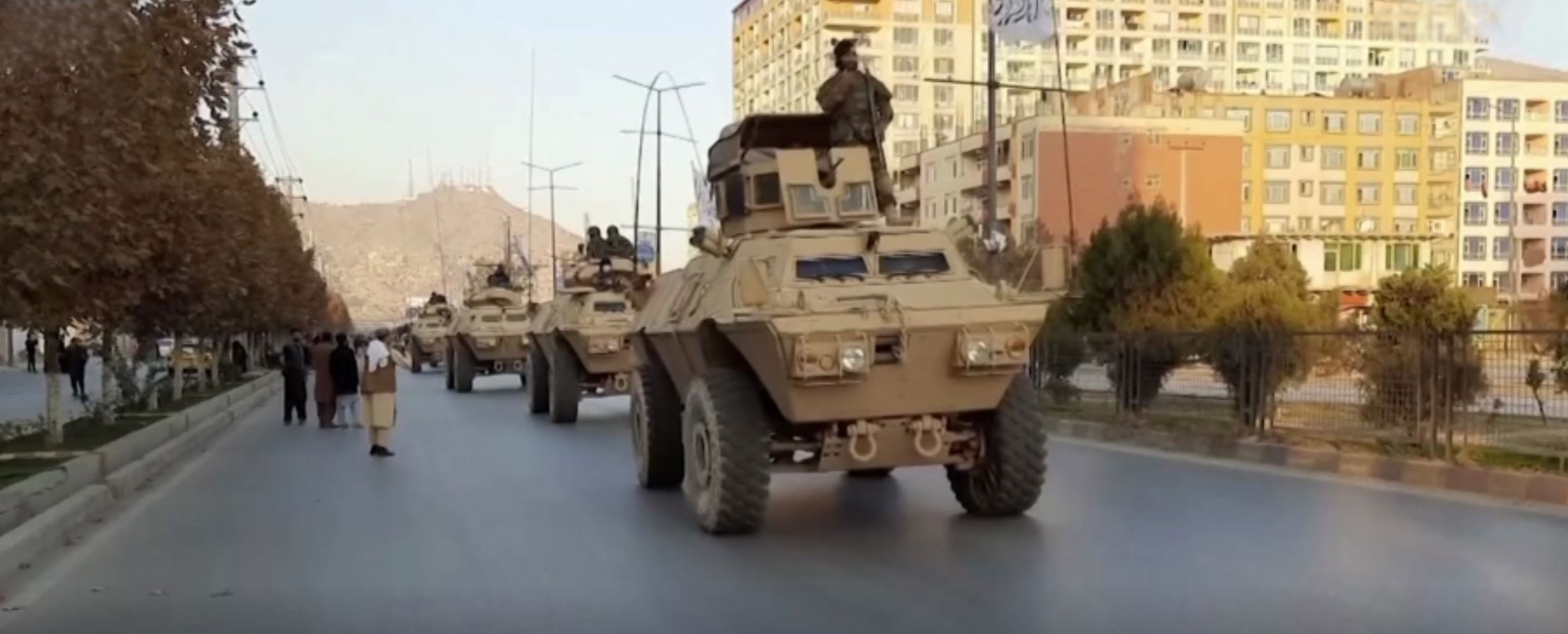 Taliban with captured American vehicles