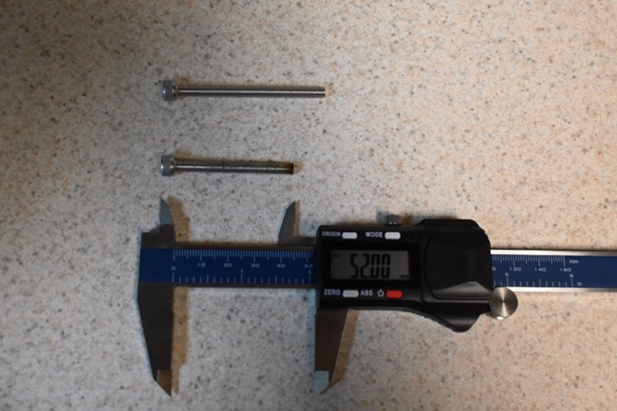 Measuring the screw.