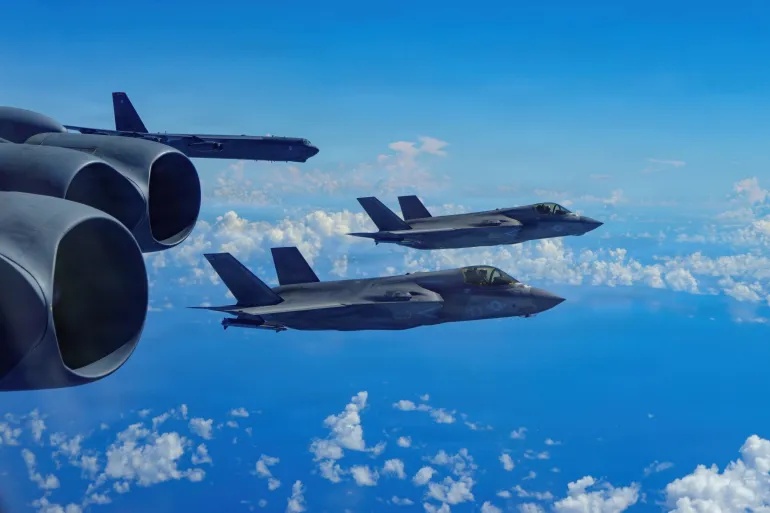 A U.S. Air Force B-52H Stratofortress bomber flies in formation with U.S. Marine Corps F-35B Lightning II fighter jets over the U.S. Southern Command area of responsibility in 2025.