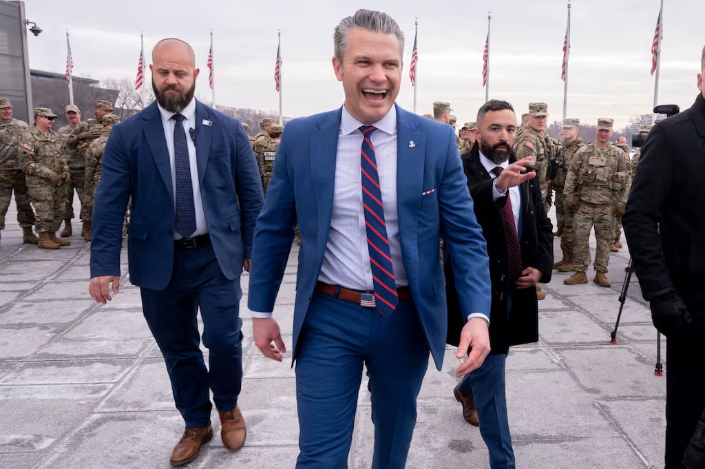 Defense Secretary Pete Hegseth walks after an oath of enlistment ceremony in February 2026 amid ongoing debate over Pentagon artificial intelligence policy.