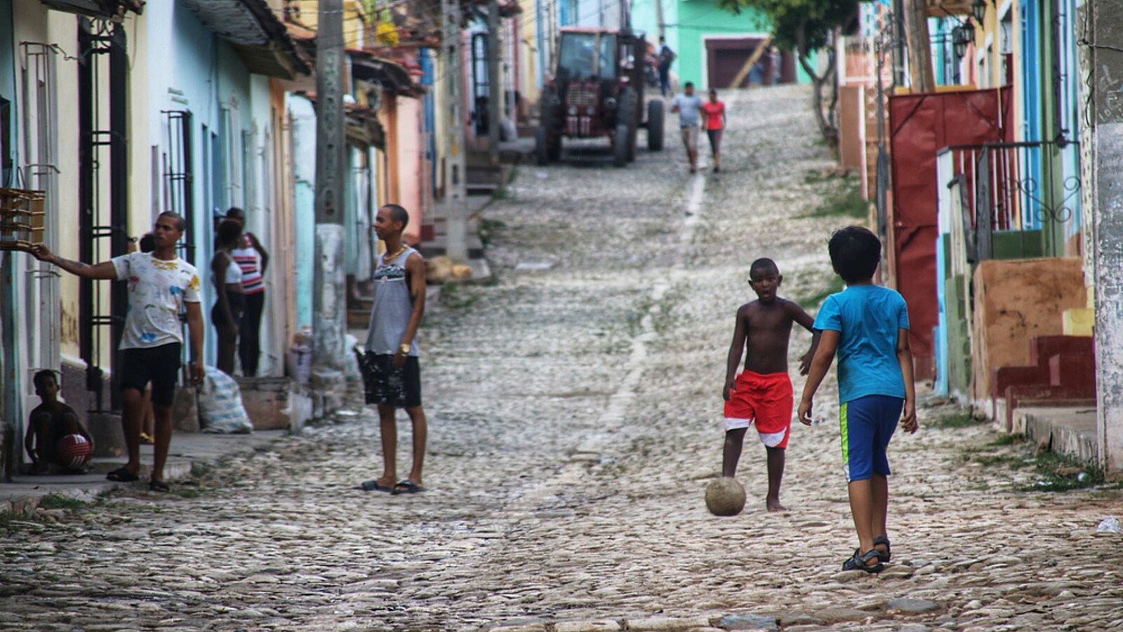 Children playing soccer in a street in Trinidad, Cuba during Cuba blackout and economic crisis.