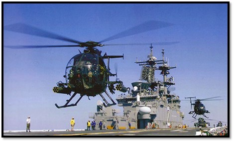 Little Birds launch from a Navy ship at sea.